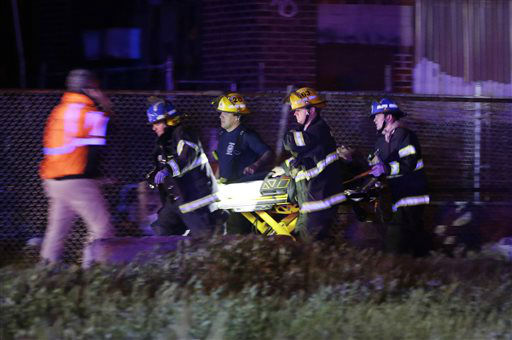 <div class='meta'><div class='origin-logo' data-origin='none'></div><span class='caption-text' data-credit='AP Photo/ Matt Slocum'>Emergency personnel transport a victim at the scene of a train wreck, Tuesday, May 12, 2015, in Philadelphia.</span></div>