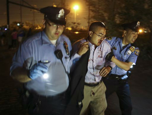 <div class='meta'><div class='origin-logo' data-origin='none'></div><span class='caption-text' data-credit='AP Photo/ Joseph Kaczmarek'>Emergency personnel help a passenger at the scene of a train wreck, Tuesday, May 12, 2015, in Philadelphia.</span></div>
