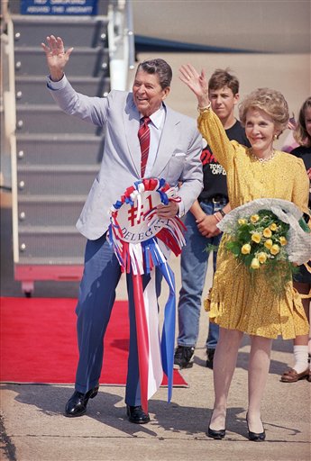 <div class='meta'><div class='origin-logo' data-origin='AP'></div><span class='caption-text' data-credit='AP'>Former President Ronald Reagan and his wife Nancy wave to about 100 supporters who greeted them as they arrived at Houston'?s Hobby Airport</span></div>