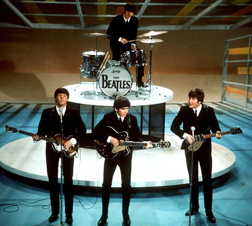 The Beatles perform on the CBS Ed Sullivan Show; in New York Feb. 9, 1964. From left, front, are Paul McCartney, George Harrison and John Lennon. <span class=meta>AP Photo</span>