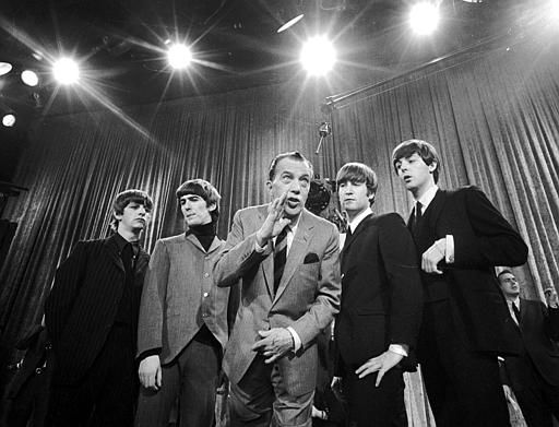 Ed Sullivan, center, stands with The Beatles during a rehearsal for the British group's first American appearance, on Feb. 8, 1964. <span class=meta>AP Photo/</span>