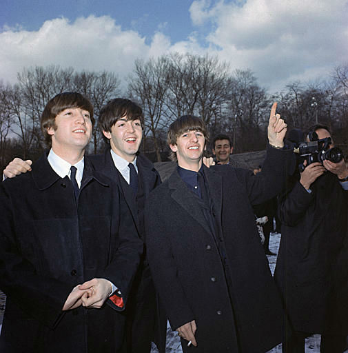 Three of the four Beatles, John Lennon, left, Paul McCartney, center, and Ringo Starr, are shown in Central Park, Feb. 10, 1964, on their first U.S. tour. <span class=meta>AP Photo</span>