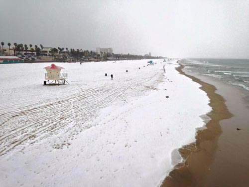 ABC7 viewer Garrett Evan Holmes captured a shot of the hail covering Huntington Beach on Monday, March 2, 2015. <span class=meta></span>