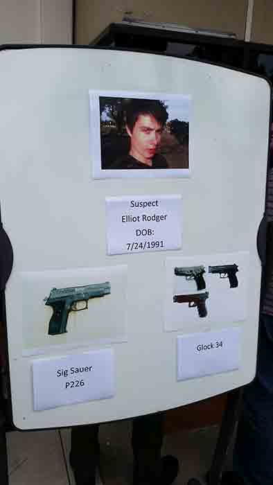 <div class='meta'><div class='origin-logo' data-origin='none'></div><span class='caption-text' data-credit=''>A board is seen showing the photos of suspected gunman Elliot Rodger and the weapons he used in Friday night's mass shooting that took place in Isla Vista, Calif.</span></div>
