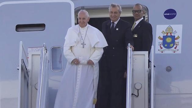 Pope Francis steps out of the plane after landing in New York on Thursday, Sept. 24, 2015.