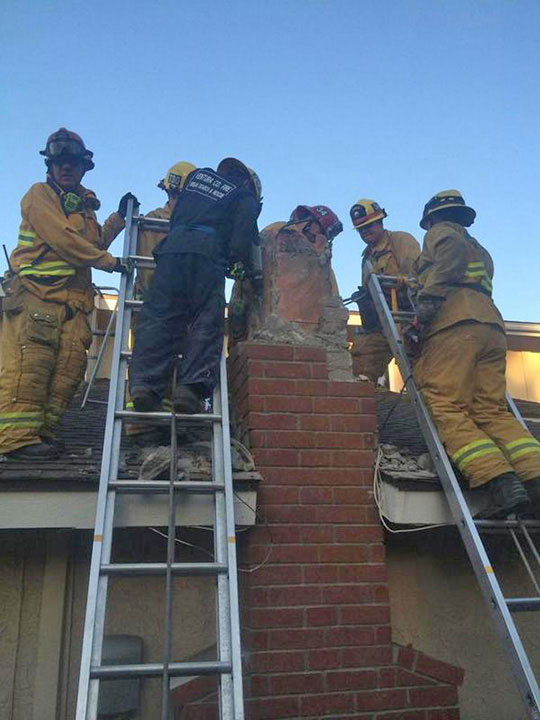 USAR members work to free a woman from a chimney in Thousand Oaks on Sunday, Oct. 19, 2014. VCFD Capt. Mike Lindbery, Twitter.com/VCFD_PIO