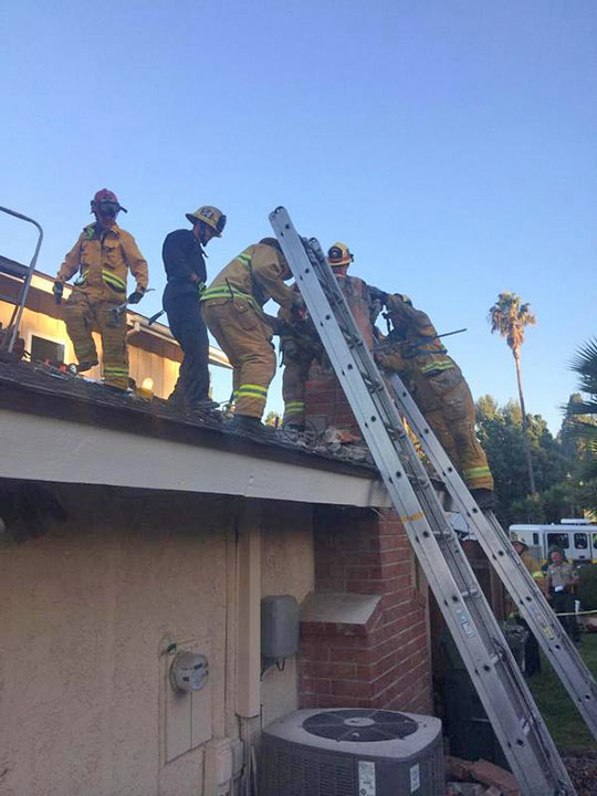 USAR members work to free a woman from a chimney in Thousand Oaks on Sunday, Oct. 19, 2014. VCFD Capt. Mike Lindbery, Twitter.com/VCFD_PIO