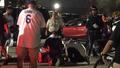 People attend to a fan who was critically injured in a fight that broke out during the NLDS opener at Dodger Stadium on Friday, Oct. 9, 2015.