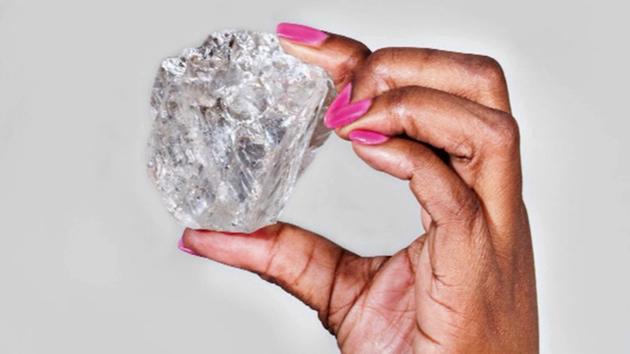In an ad for a Canadian-based diamond company, a woman holds up an 1,111-carat diamond.