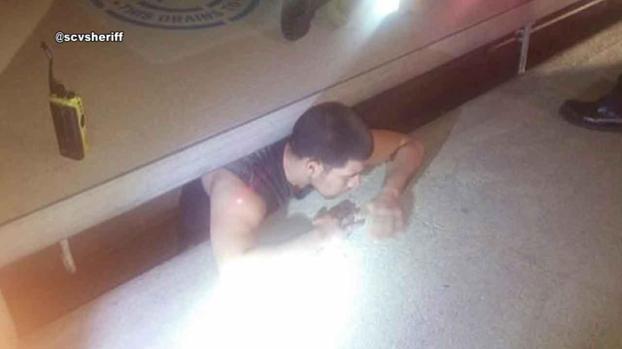 Would-be car thief tries to flee from deputy, gets stuck in storm drain
