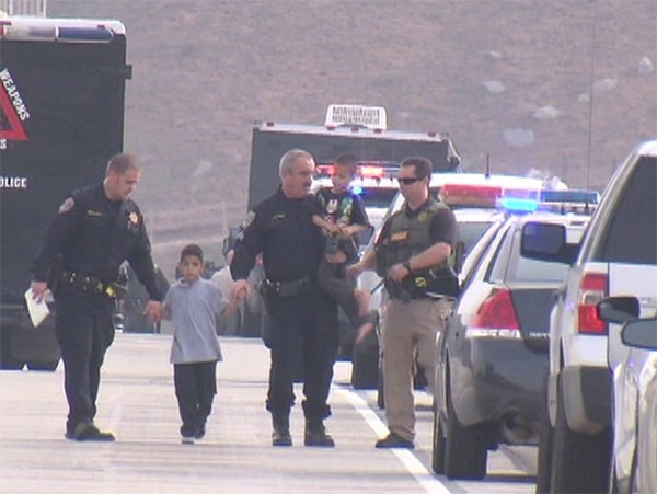 <div class="meta image-caption"><div class="origin-logo origin-image "><span></span></div><span class="caption-text">Officers escort two of four kids who were the subject of an Amber Alert during a standoff on a San Diego County freeway on Thursday, Dec. 11, 2014. (KGTV)</span></div>