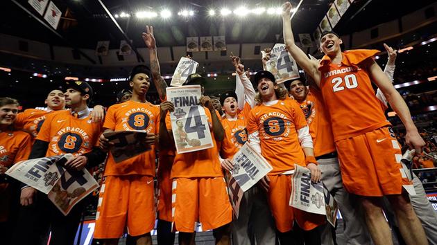 Syracuse players celebrate after an NCAA college basketball game against Virginia in the regional finals of the NCAA Tournament, Sunday, March 27, 2016, in Chicago.