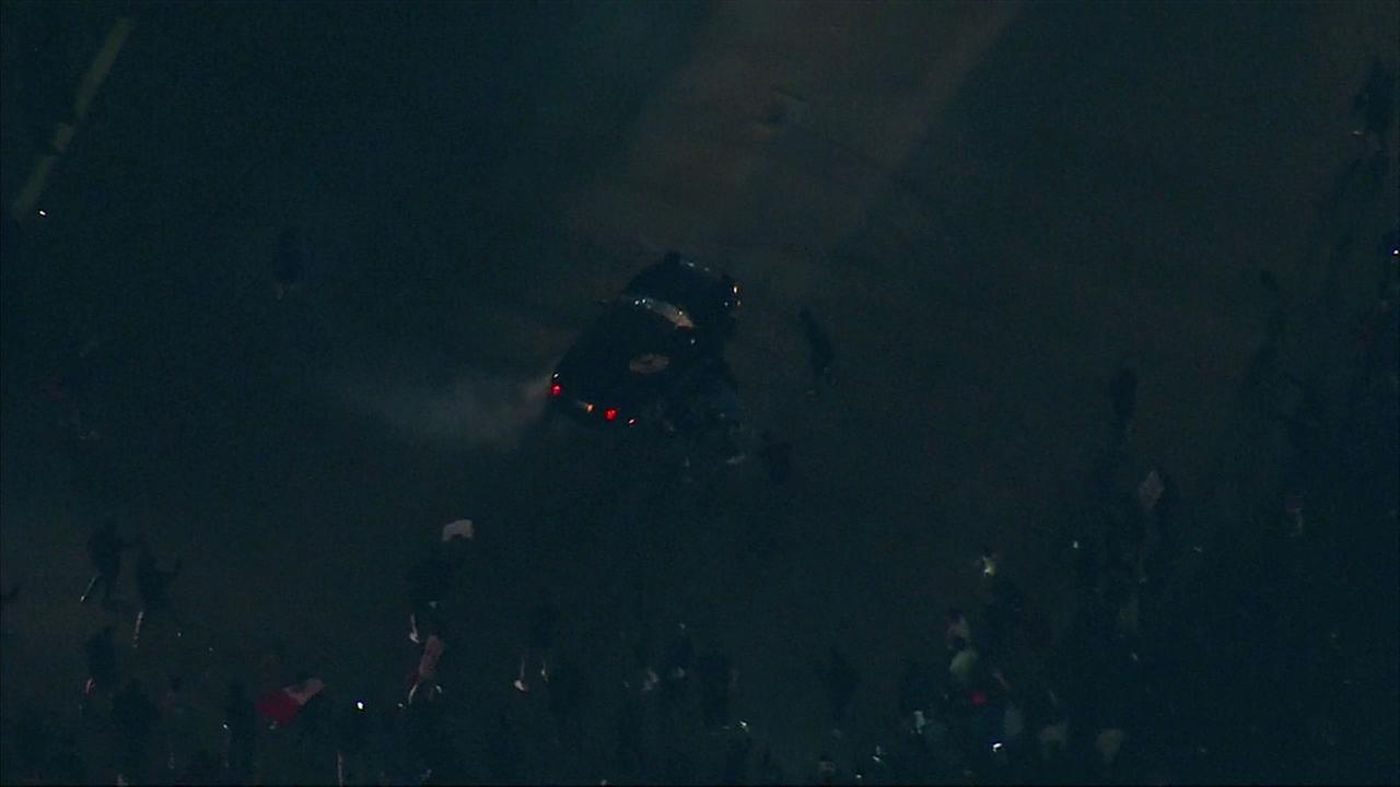 VIDEO: Car does donuts around Donald Trump protesters