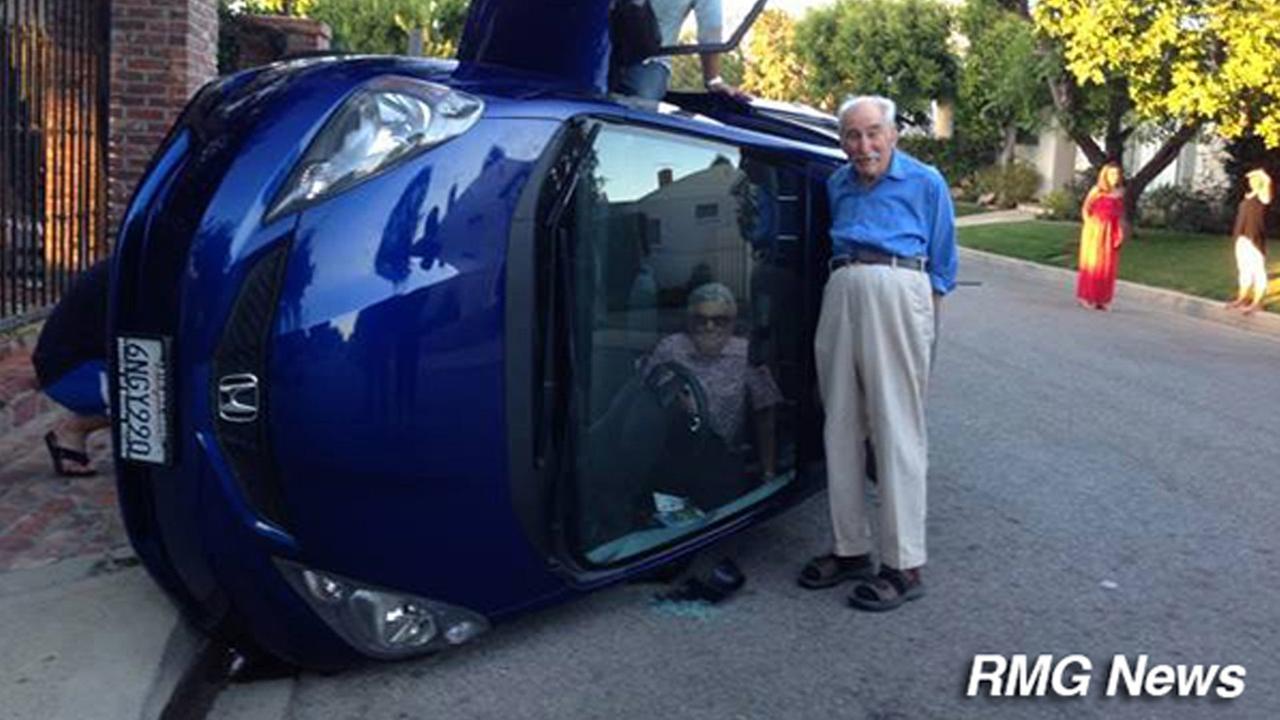Elderly couple snaps photos after flipping car