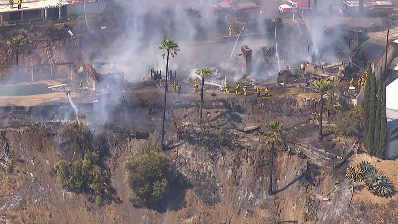 Brush fire contained after burning five homes in San Bernardino