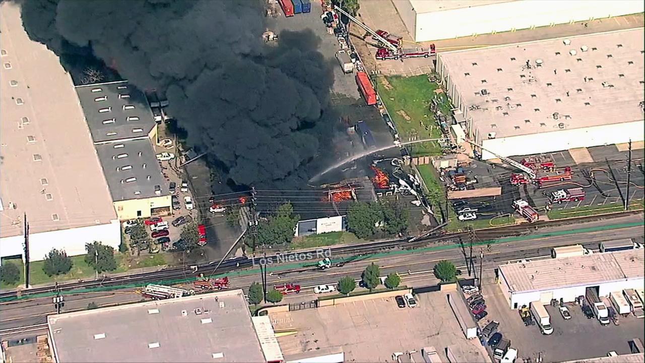 Crews battle massive commercial fire in Santa Fe Springs