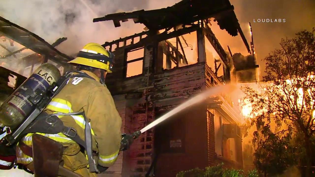 Dramatic fire burns 2 buildings on county property in Downey