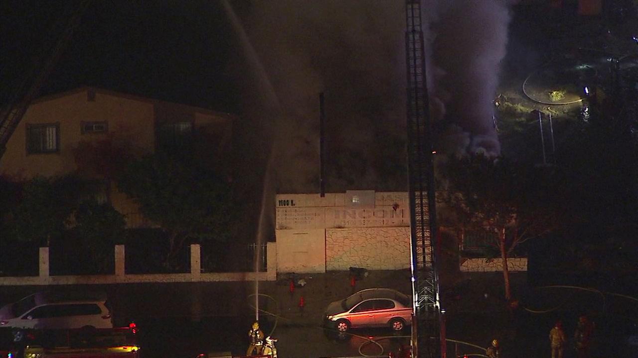 Firefighters battle structure fire at vacant building in Compton