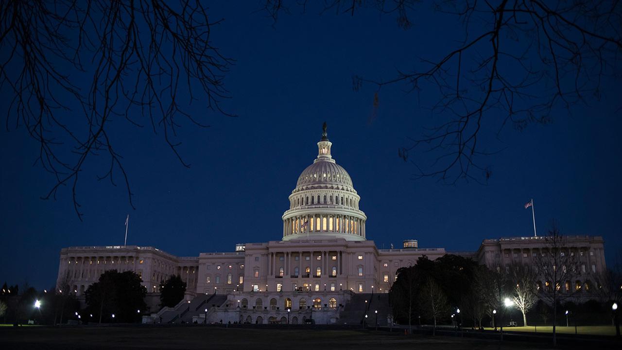 With no apparent indications of a breakthrough in the Senate to avoid a government shutdown, the Capitol is illuminated in Washington, Friday evening, Jan. 19, 2018.
