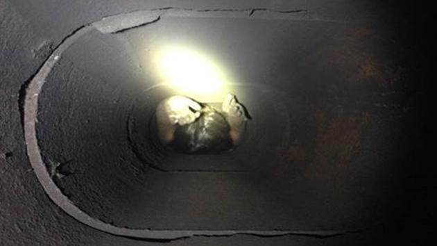 Genoveva Nunez-Figueroa is seen trapped in a chimney in Thousand Oaks on Sunday, Oct. 19, 2014. 
