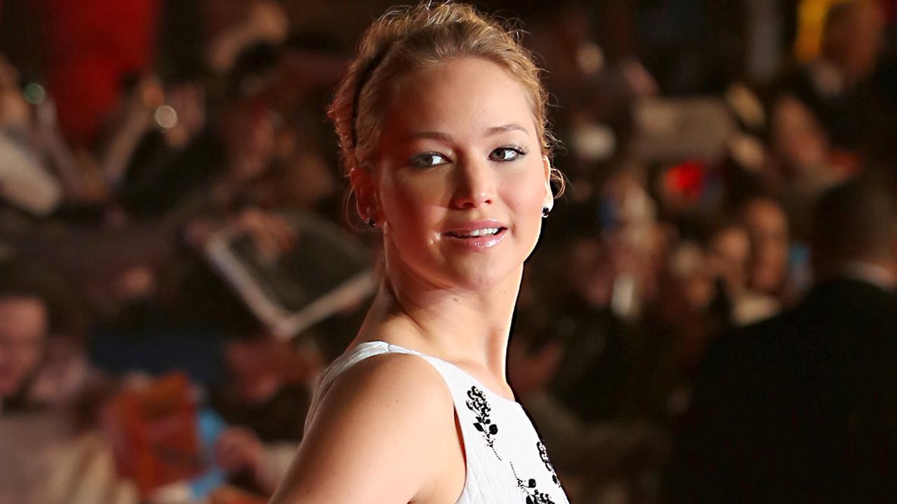Jennifer Lawrence poses for photographers upon arrival to the world ...