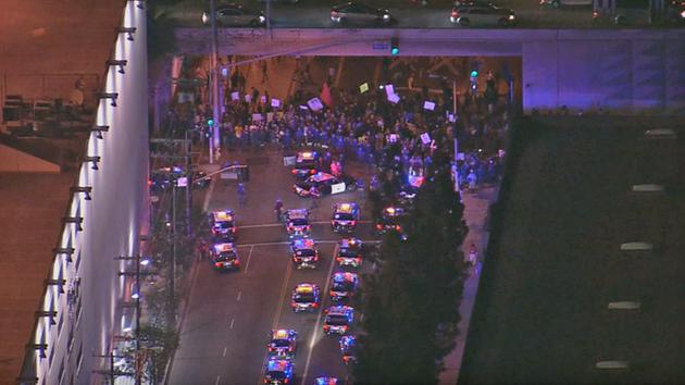 Crowds gathered on Martin Luther King Jr. Boulevard at the 110 Freeway, 6 p.m. Tuesday, Nov. 25, 2014. <span class=meta></span>