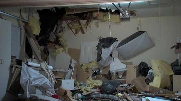 An SUV went airborne and crashed through the roof of an Escondido home on Wednesday, Dec. 10, 2014.