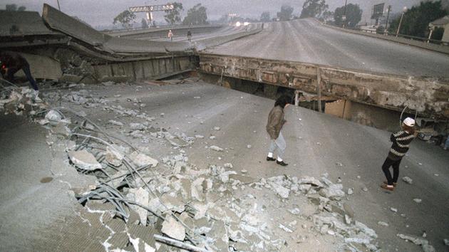 In this Jan. 17, 1994 file photo, the Santa Monica Freeway has split and collapsed over La Cienega Boulevard following the Northridge quake in the predawn hours.