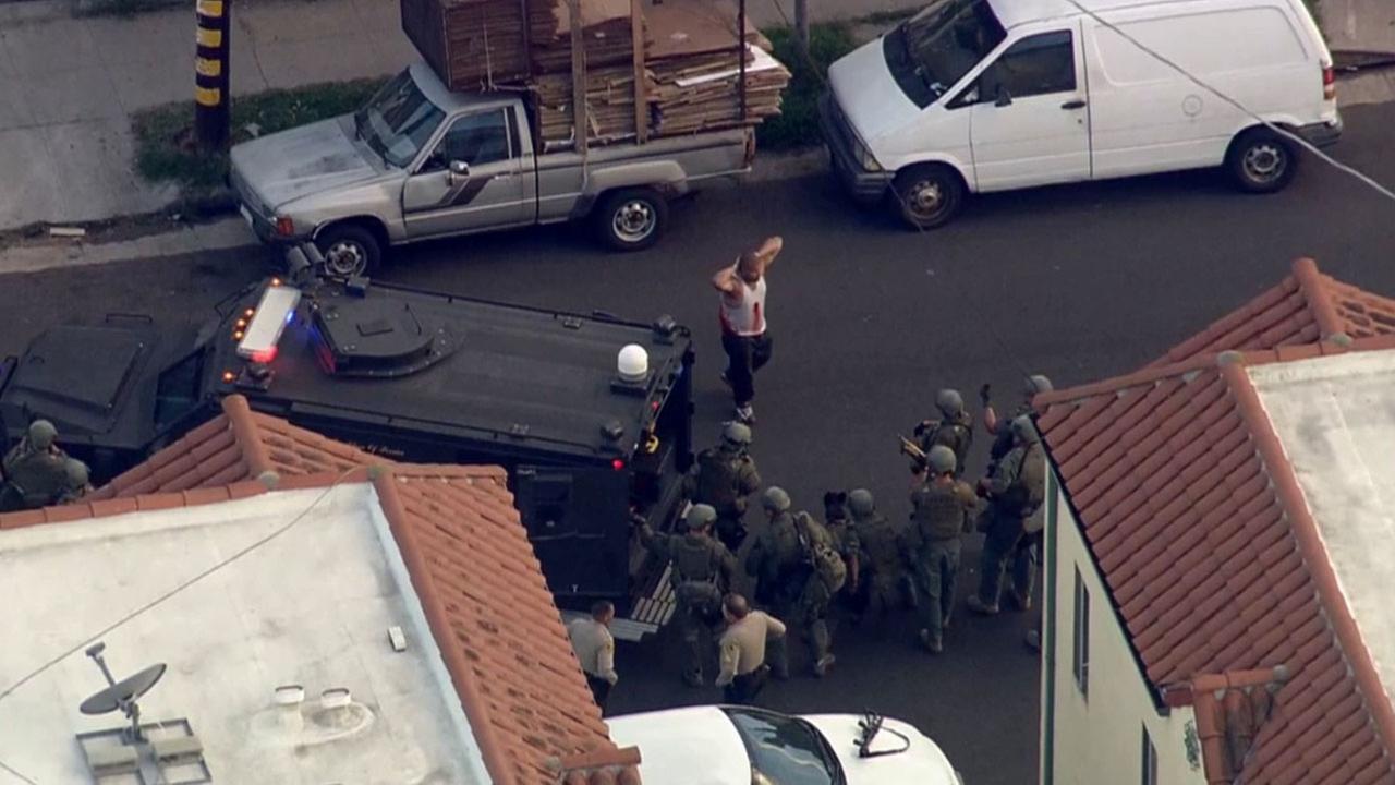 Wounded chase suspect surrenders following standoff in South Los