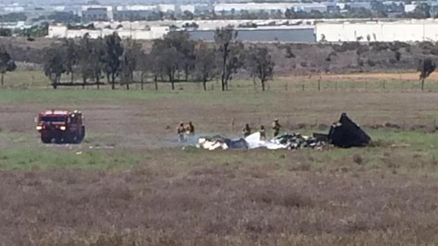 Emergency personnel are shown at the scene of a plane crash in San Diego County on Sunday, Aug. 16, 2015.