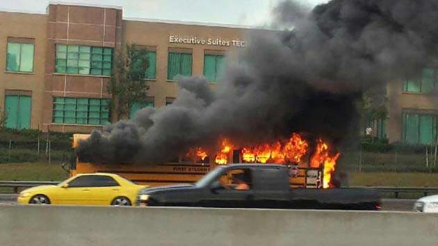 A school bus carrying water polo athletes erupted in flames on the northbound 5 Freeway near the Jeffrey Road exit in Irvine on Wednesday, Sept. 9, 2015. 