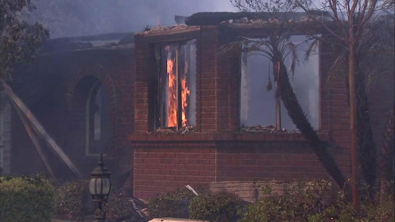 Smoke and ash from nearby brushfire gives Disneyland an ominous look