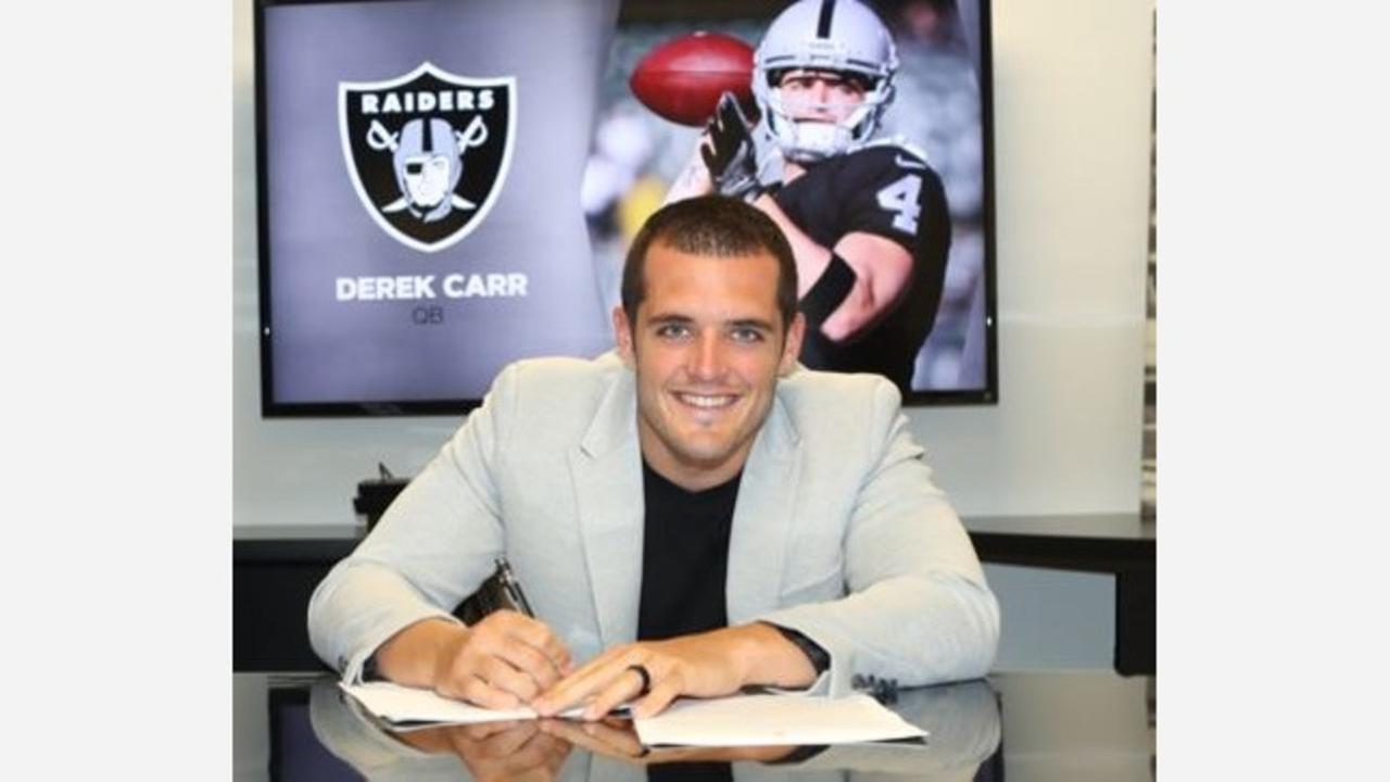 Derek Carr smiles at contract extension signing