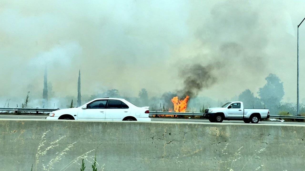 Fire burning next to HWY 41 and HWY 180 in Fresno