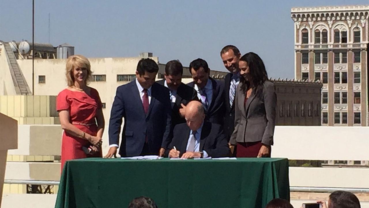 Gov Jerry Brown signs four climate change bills in downtown Fresno