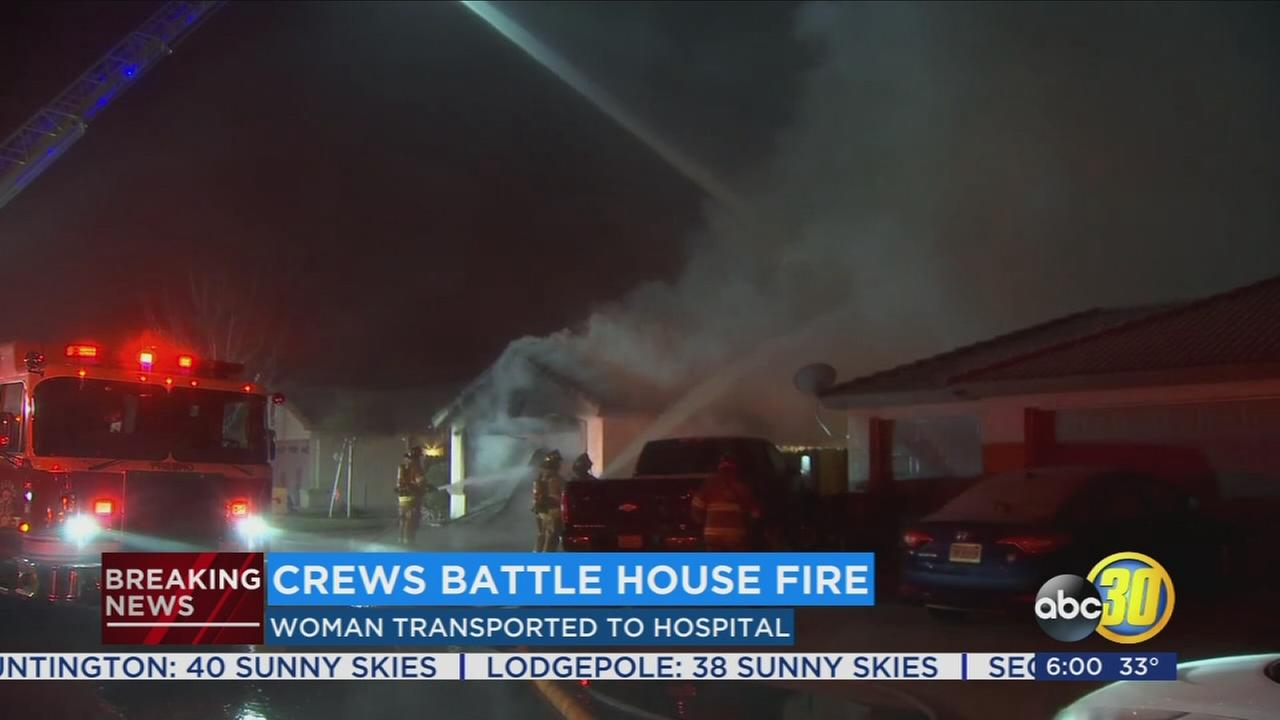 Woman taken to hospital after early morning house fire in Northwest Fresno