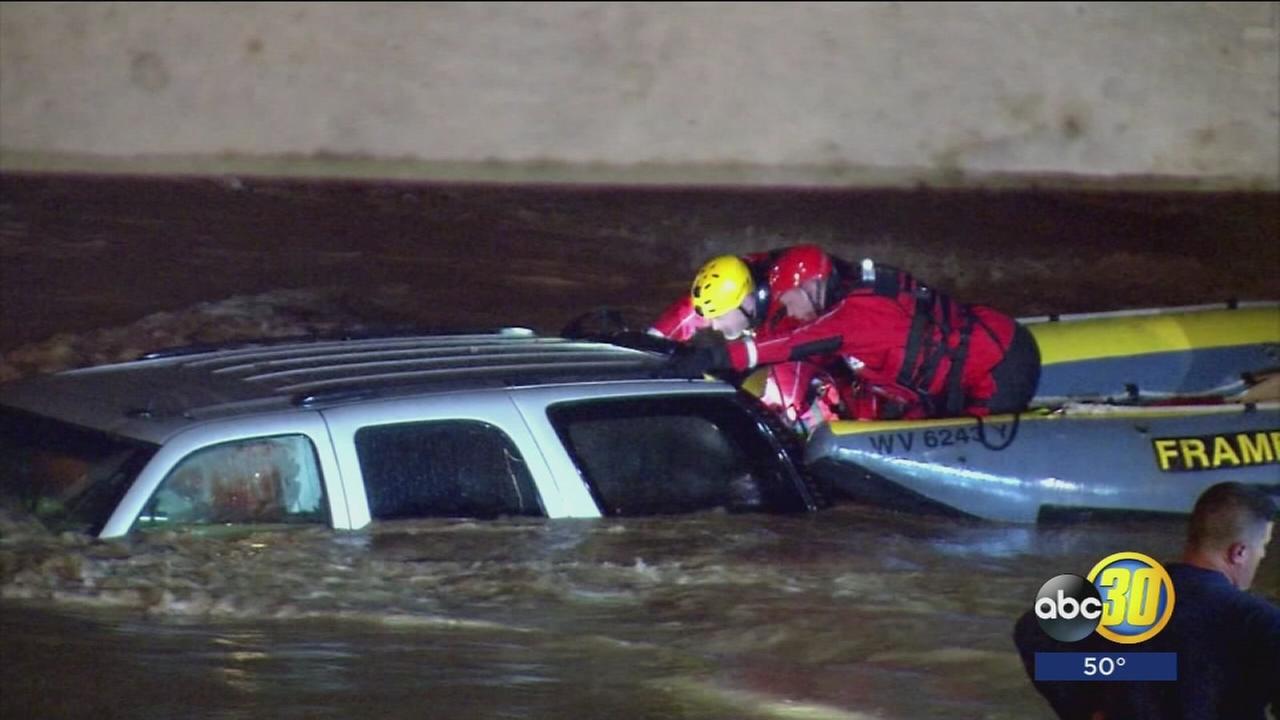 Man rescued from SUV as flood waters continue to rise in West Virginia