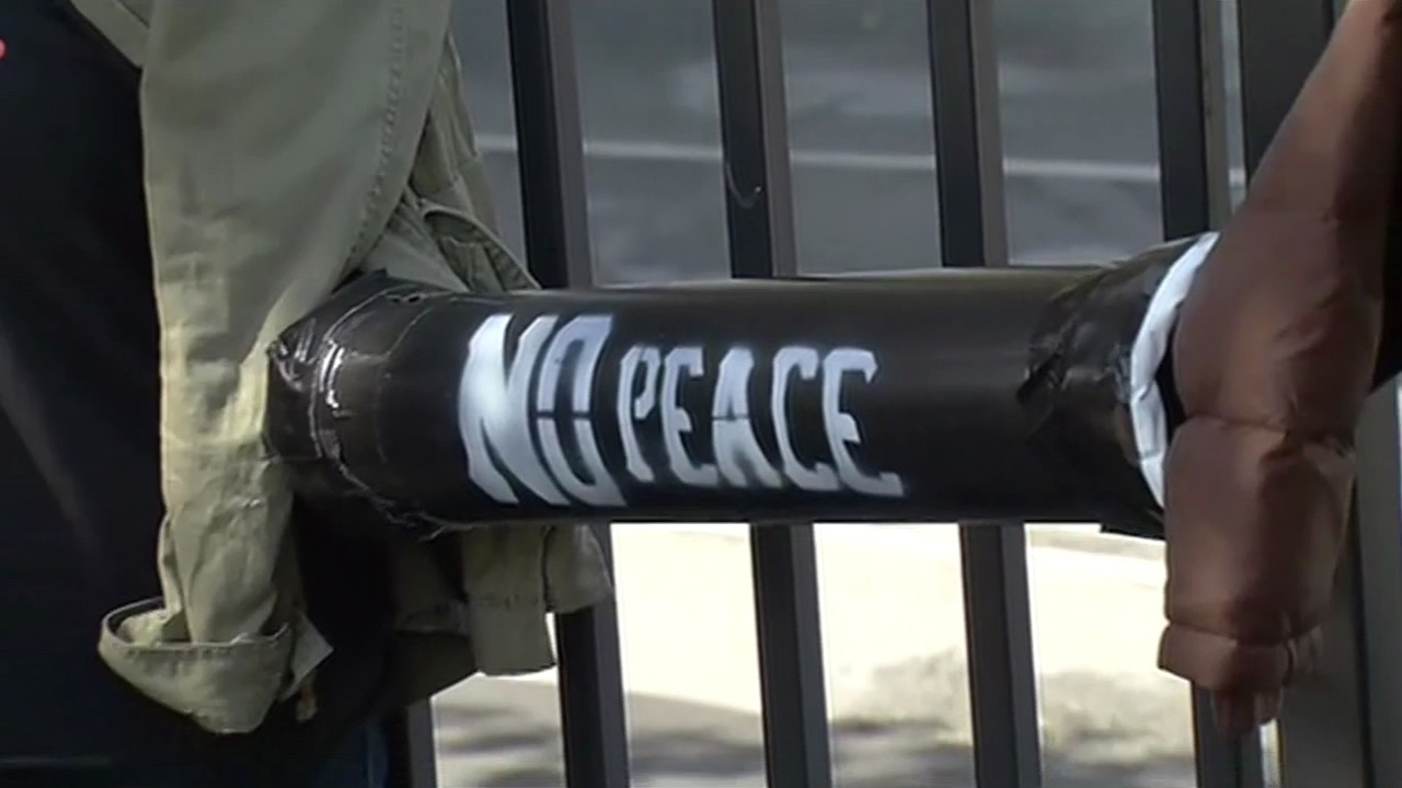 <div class='meta'><div class='origin-logo' data-origin='KGO'></div><span class='caption-text' data-credit=''>Protesters chained themselves to the gates of the Mission District Police Station in San Francisco on Monday, March 23, 2015. (KGO-TV)</span></div>