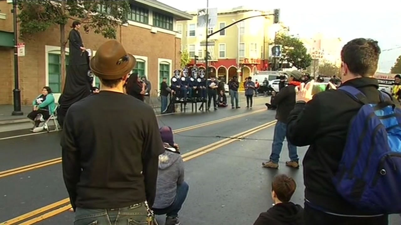 <div class='meta'><div class='origin-logo' data-origin='KGO'></div><span class='caption-text' data-credit=''>Protesters chained themselves to benches along the street as well on Monday, March 23, 2015. (KGO-TV)</span></div>