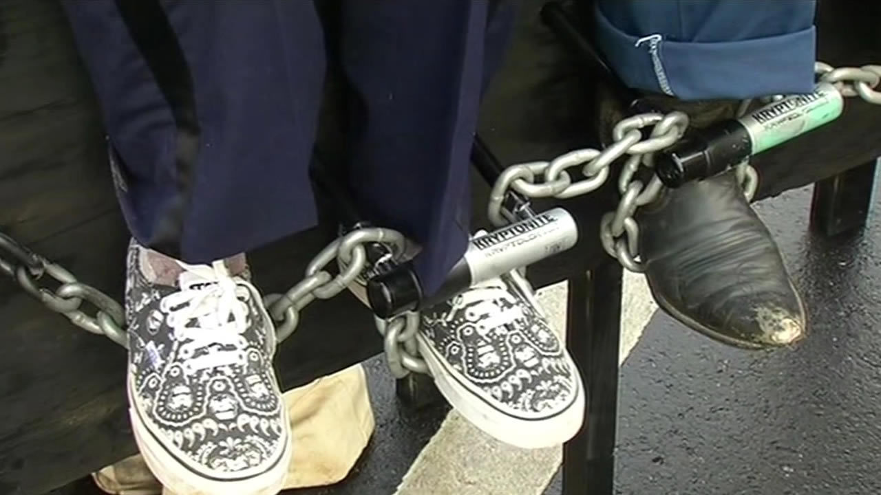 <div class='meta'><div class='origin-logo' data-origin='KGO'></div><span class='caption-text' data-credit=''>Protesters chained themselves to benches along the street as well on Monday, March 23, 2015. (KGO-TV)</span></div>
