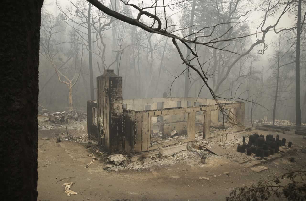 Only the chimney and walls remain of a home destroyed by fire along Highway 175 Sunday, Sept. 13, 2015, near Middletown, Calif. <span class=meta>AP Photo/Eric Risberg</span>