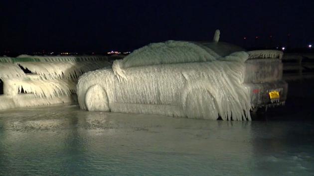 This image shows a parked car covered in ice near Lake Erie in Buffalo, New York on Monday, January 11, 2016.