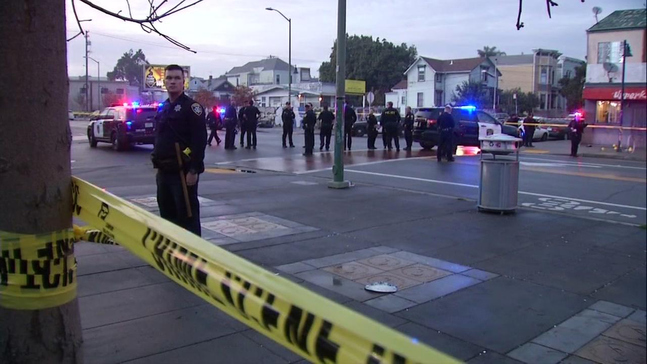 Officials survey the area of a shooting at West Oakland BART in West Oakland, Calif. on Wednesday, Jan. 3, 2017.
