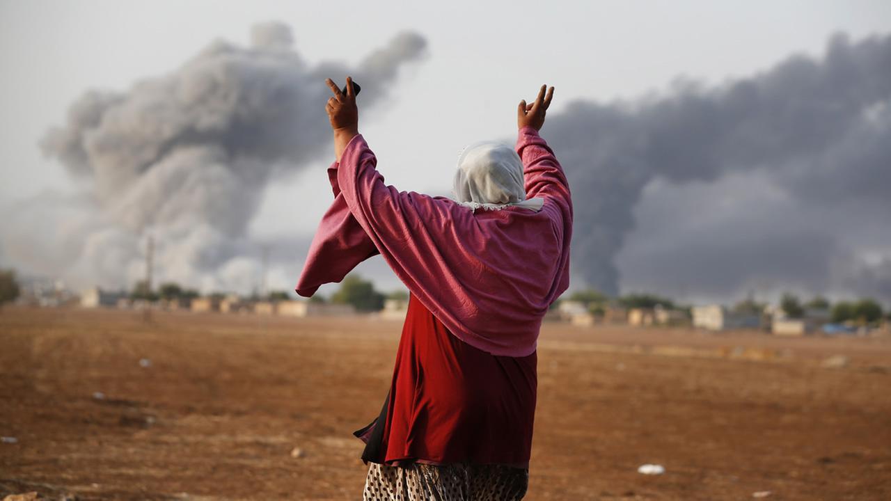 A thick smoke rises following an airstrike by the US-led coalition in Kobani