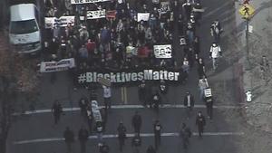 Protesters marching against police brutality on Market Street in San Francisco