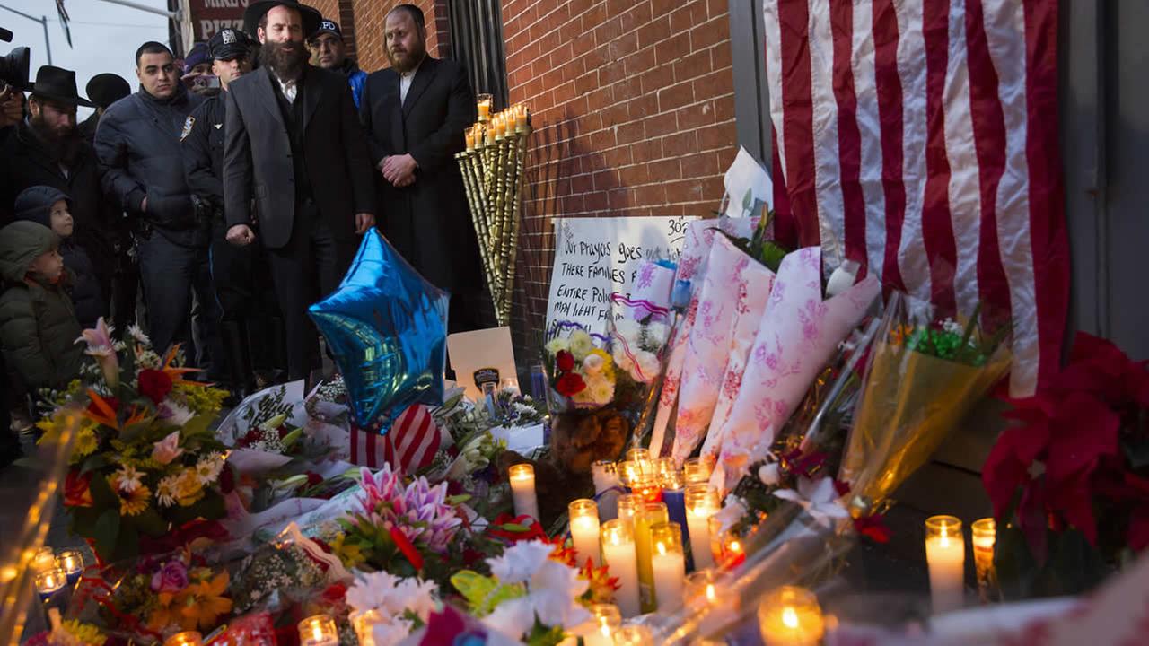 Vigil for two fallen New York Police Department officers growing.