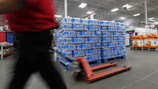 A customer walks past this Nestle Pure Life water display at this Jackson, Miss., Sams Club, Tuesday, March 5, 2013. (AP Photo/Rogelio V. Solis)