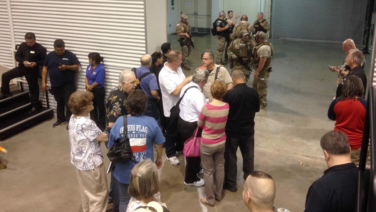 Dallas officials say two gunmen killed outside Muhammad cartoon.