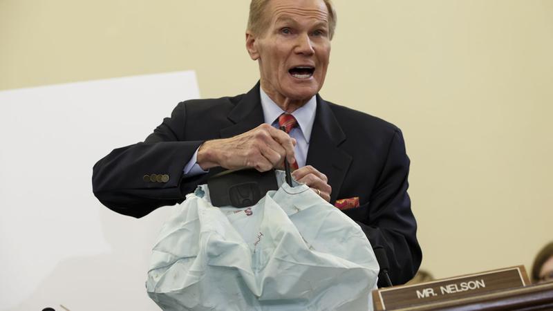 Senate Commerce Committee member Sen. Bill Nelson, D-Fla. displays the parts and function of a defective airbag made by Takata of Japan on Nov. 20, 2014. (AP Photo)