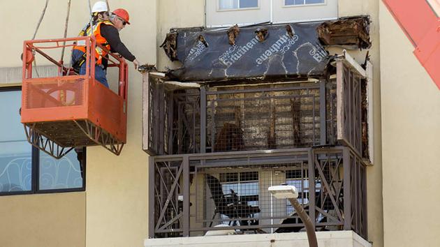 Workers examine a balcony that collapsed in Berkeley, Calif., Tuesday, June 16, 2015. <span class=meta>AP Photo/Noah Berger</span>